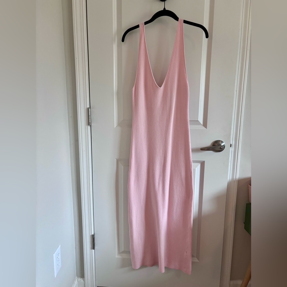 Free people beach brand. Low back and snug fit. Stretch knit material